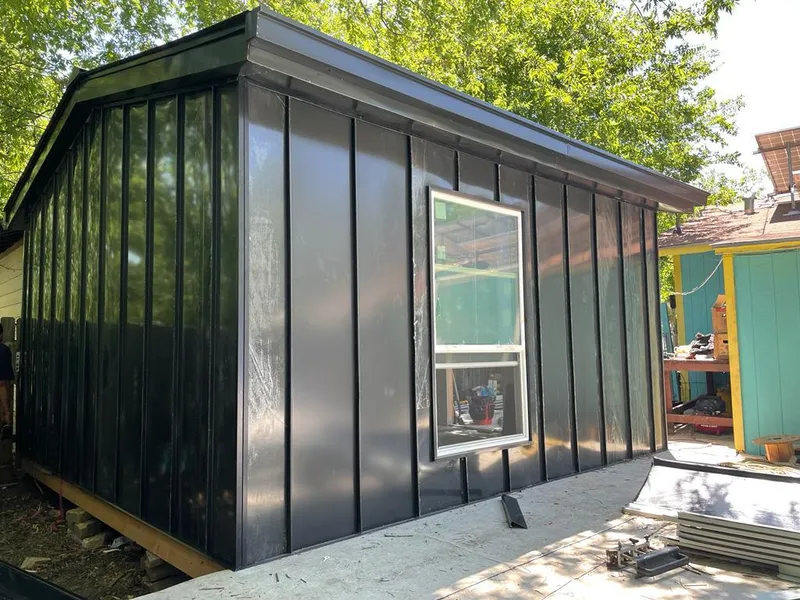 Black standing seam metal wall panels for Metal Roof Installation in St. Peter