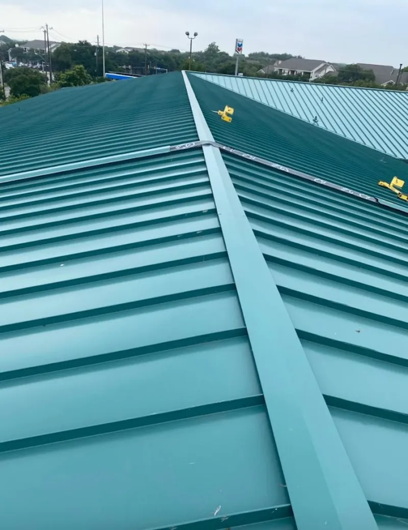 Green commercial metal roof ridge and valley for Metal Roof Repair in St. Peter